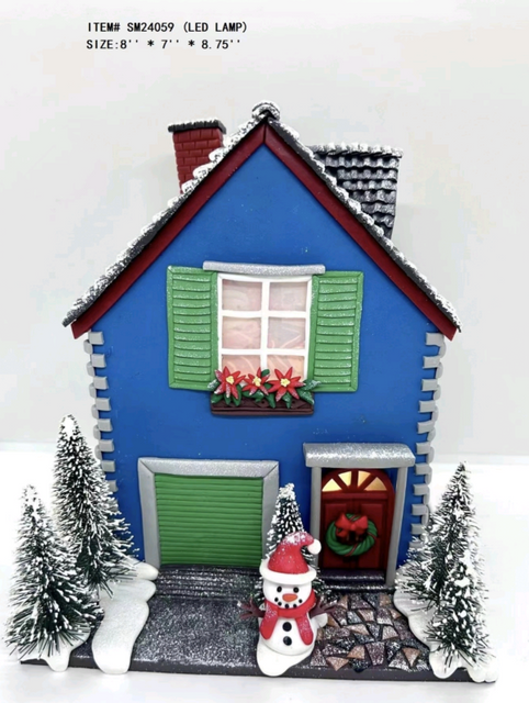 黏土造型雪人站在蓝色房子灯前 - 26